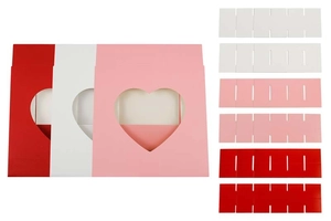 Detail of heart window gift boxes in red, white and pink with inner chocolate dividers