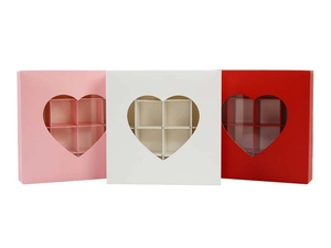 Detail of square gift boxes with heart windows and 6-grid dividers in pink, white, red