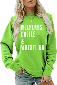 Detailed view of ribbed cuff and hem on bright green crewneck sweatshirt with white print