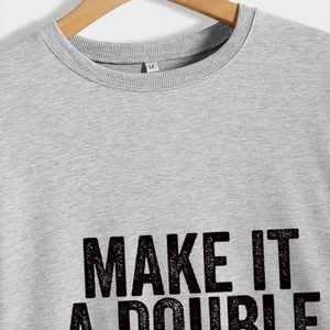 Grey crewneck sweatshirt featuring a vintage Make It A Double print on a wooden hanger