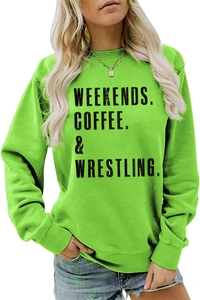 Detail of lime green sweatshirt with black Weekends Coffee wrestling text and ribbed cuff