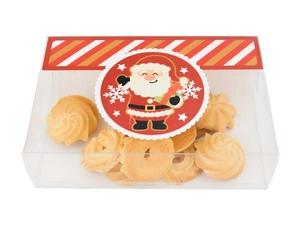 Close-up of a clear PVC Christmas cookie box with Santa Claus sticker and butter cookies