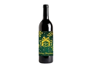Close-up of premium green and gold Merry Christmas wine bottle label with metallic foil