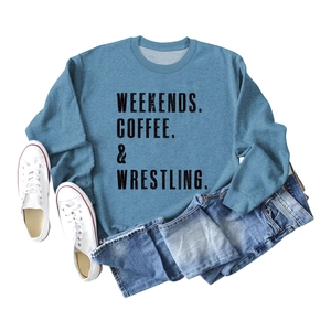 Flat lay of blue crewneck sweatshirt with Weekends Coffee and Wrestling text print