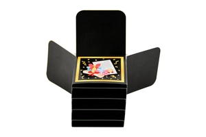 Detailed view of an open black 3D explosion gift box with festive golden decorations