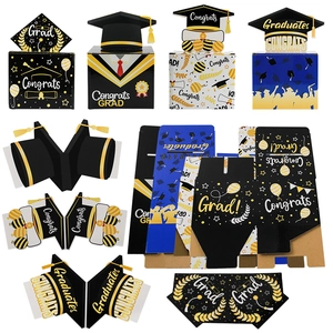 Detail of graduation gift money boxes featuring mortarboard caps and tassels