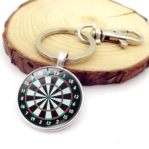 Vintage dartboard pendant keychain with glass dome on round wooden base display