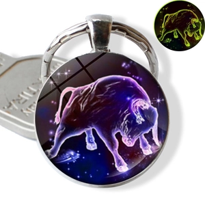 Luminous Taurus zodiac keychain with blue starry sky glass pendant and glow effect