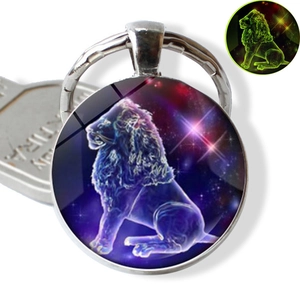 Detailed macro of Leo zodiac sign glowing glass pendant with silver keychain