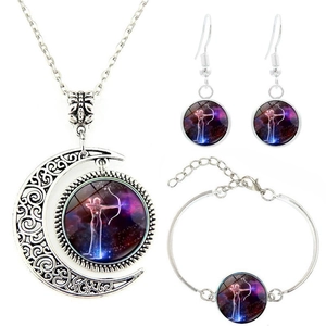 Detail showing Sagittarius zodiac moon necklace, bracelet and earrings set with nebula glass