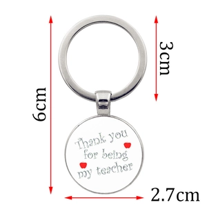 Silver teacher appreciation keychain with Thank You message and red apple icons
