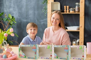 Easter window gift boxes with rabbit and egg patterns in a warm family kitchen scene