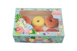 Easter gift box with transparent window showing colorful donuts and bunny patterns