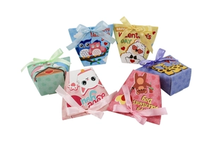 Macro detail of six animal-themed Valentine gift boxes with silk ribbons and heart patterns