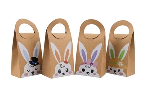 Detailed view of four kraft paper Easter bunny gift bags with cartoon ears and handles