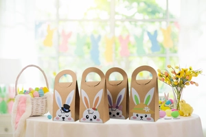 Detailed set of four Easter kraft paper gift bags with cute cartoon bunny characters