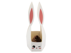 Detail of white 3D bunny gift box featuring long ears and a winking face with a cupcake