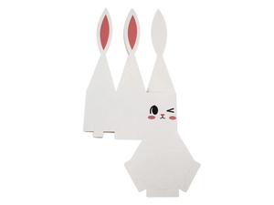 Close-up of cute rabbit gift box featuring a minimalist winking face and pink ears