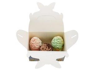 Macro view of butterfly shape clasp and floral pattern on white paper cupcake box