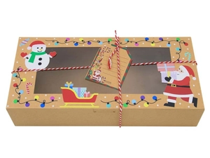 Macro detail of Christmas kraft paper gift box with clear window and festive motifs