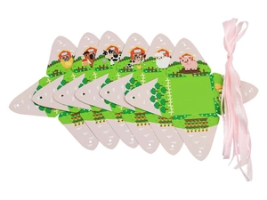 Flat lay of farm animal theme paper gift boxes with chick, cow prints and pink ribbon