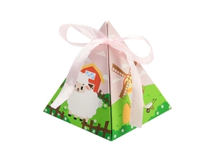 Macro detail of pyramid gift box with farm animal patterns and pink ribbon bow