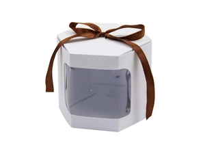 Detail of white hexagonal gift box with a transparent window and brown ribbon bow