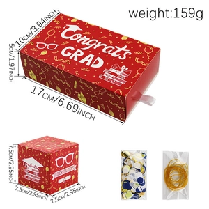 Detail view of red graduation gift box set with Congrats Grad patterns and dimensions