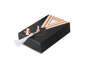 Detail of graduation gown favor box with black drawer design and white silk tassel detail