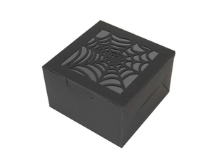 Detail of square black Halloween gift box with laser-cut spider web pattern on the lid