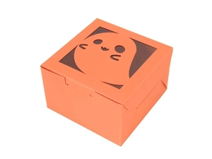 Detail view of orange Halloween cookie box with ghost-shaped cutout window and square design