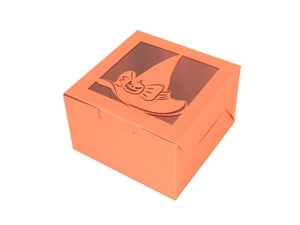 Detail of orange Halloween gift box with laser-cut pumpkin window and witch hat design