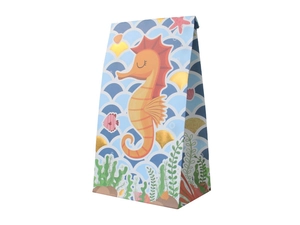 Détail d'un sac alimentaire en papier sulfurisé avec hippocampe et coquillages dorés