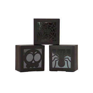 Halloween black card boxes with laser-cut spider web, skull, and spider patterns for candy