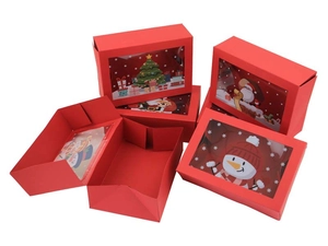 Detail of red Christmas gift box with transparent window and festive illustrations