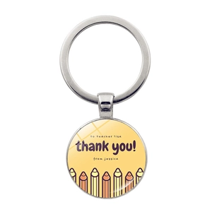 Detail of custom teacher gift keychain with glass gem and colorful pencil illustration