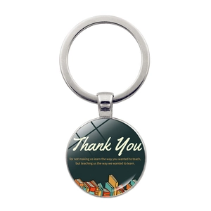 Close-up of Teacher Appreciation keychain with glass dome and inspirational quote