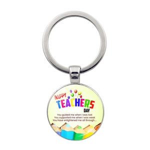 Macro detail of alloy keychain with Happy Teachers Day colorful art print and gift quote