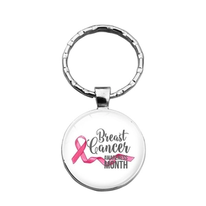 Detailed view of Breast Cancer Awareness keychain with pink ribbon in glass pendant