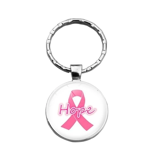 Detailed macro view of the silver metal keychain with Hope text and pink ribbon charm