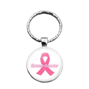 Detailed close-up of a silver metal keychain featuring a breast cancer pink ribbon glass pendant