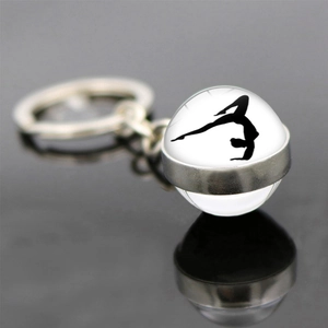 Artistic gymnastics glass ball keychain with silver metal ring and yoga silhouette