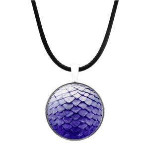 Macro detail of purple dragon scale glass dome pendant with silver metal trim on leather cord