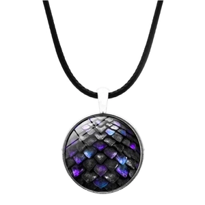 Macro detail of round glass pendant featuring iridescent dragon scale texture on black cord