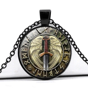 Macro shot of Viking pendant with winged sword and Nordic runes under time gem glass