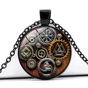 Close-up of Viking compass pendant with black chain and detailed steampunk gear motifs