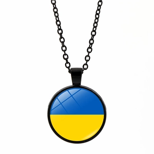 Detail of Ukraine flag cabochon pendant with black chain and clear glass dome