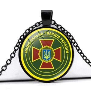 Macro view of black glass pendant necklace with Ukrainian National Guard military emblem
