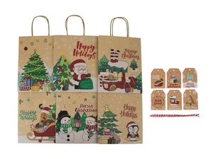 Macro view of Christmas kraft paper gift bag set with tags and red white twine string