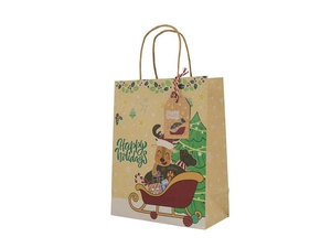 Detail of Christmas kraft paper gift bag with reindeer, tree and Happy Holidays tag